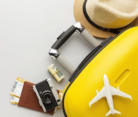 flat-lay-yellow-luggage-with-copy-space